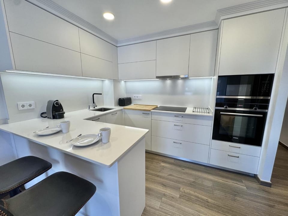 Kitchen or kitchenette, stove, toaster