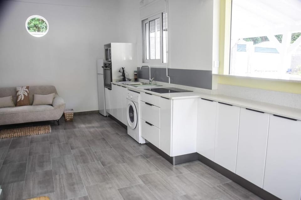 Kitchen or kitchenette, oven, stove, washing machine
