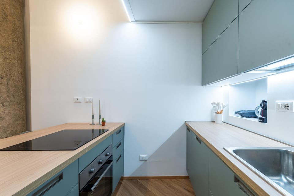 Kitchen or kitchenette, dishwasher, oven, stove