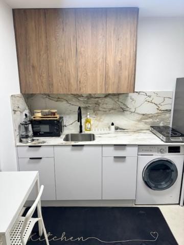 Kitchen or kitchenette, stove, washing machine