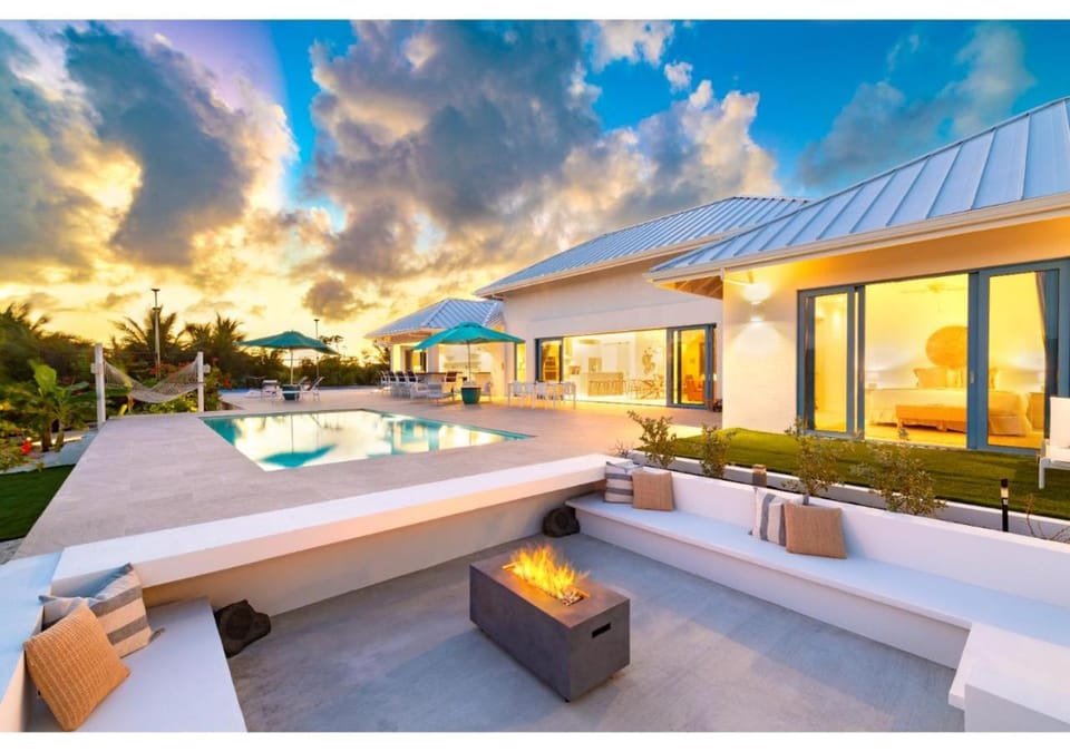 Property building, Patio, Natural landscape, Pool view, fireplace