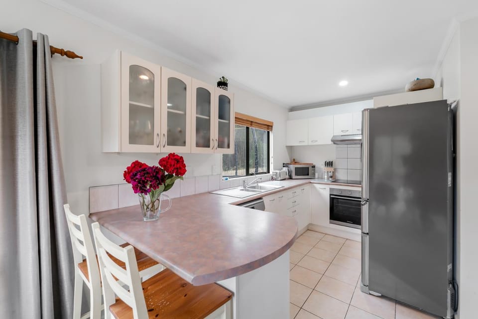Kitchen or kitchenette, dishwasher, oven, stove