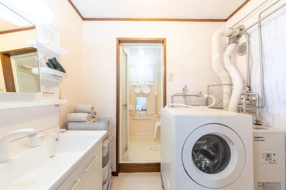 Shower, Bathroom, Bath, hair dryier, towels, laundry, washing machine, dryer