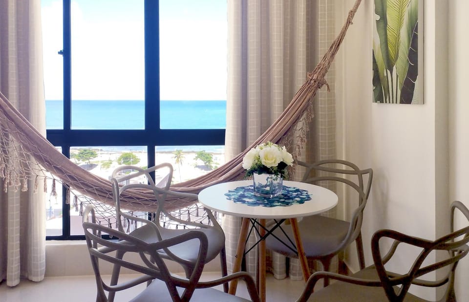 View (from property/room), Living room, Dining area, Beach, Sea view