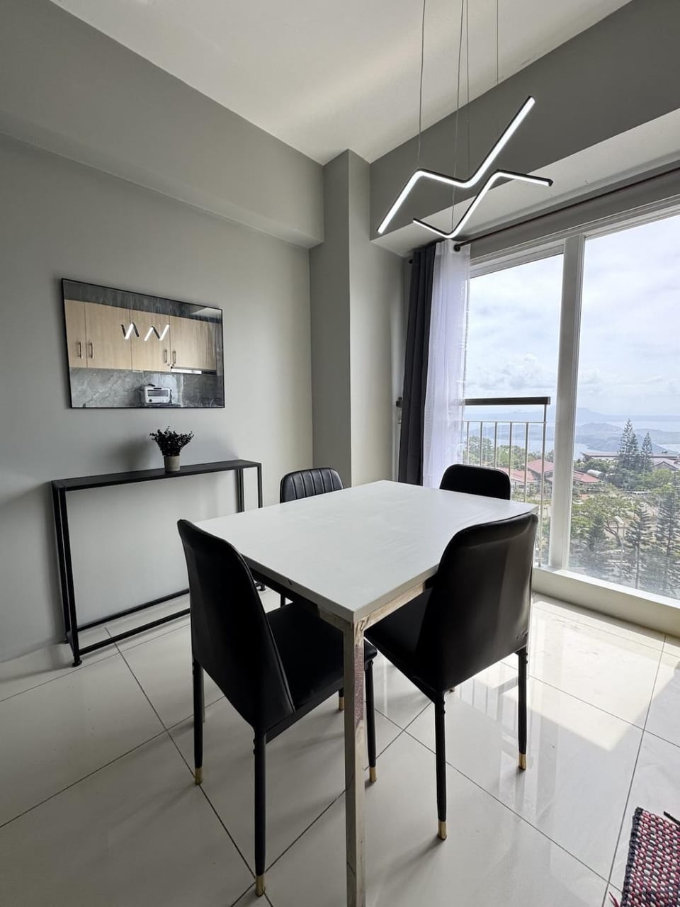 Monochrome Bauhaus Studio with Lake View at SMDC Wind Apartment in Tagaytay