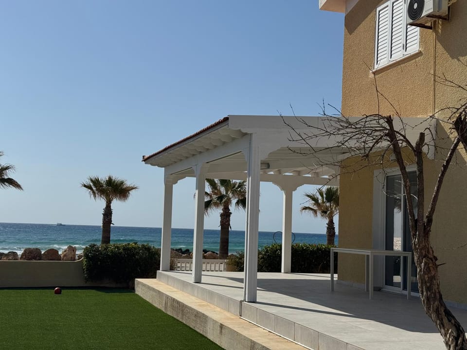 Property building, Patio, Natural landscape, Beach, Sea view