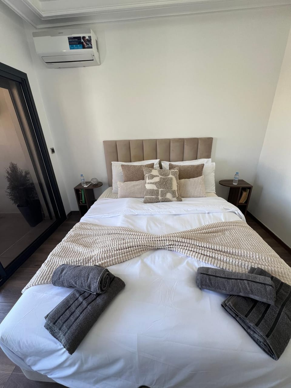 Bed, Photo of the whole room, Bedroom, towels, air conditioner