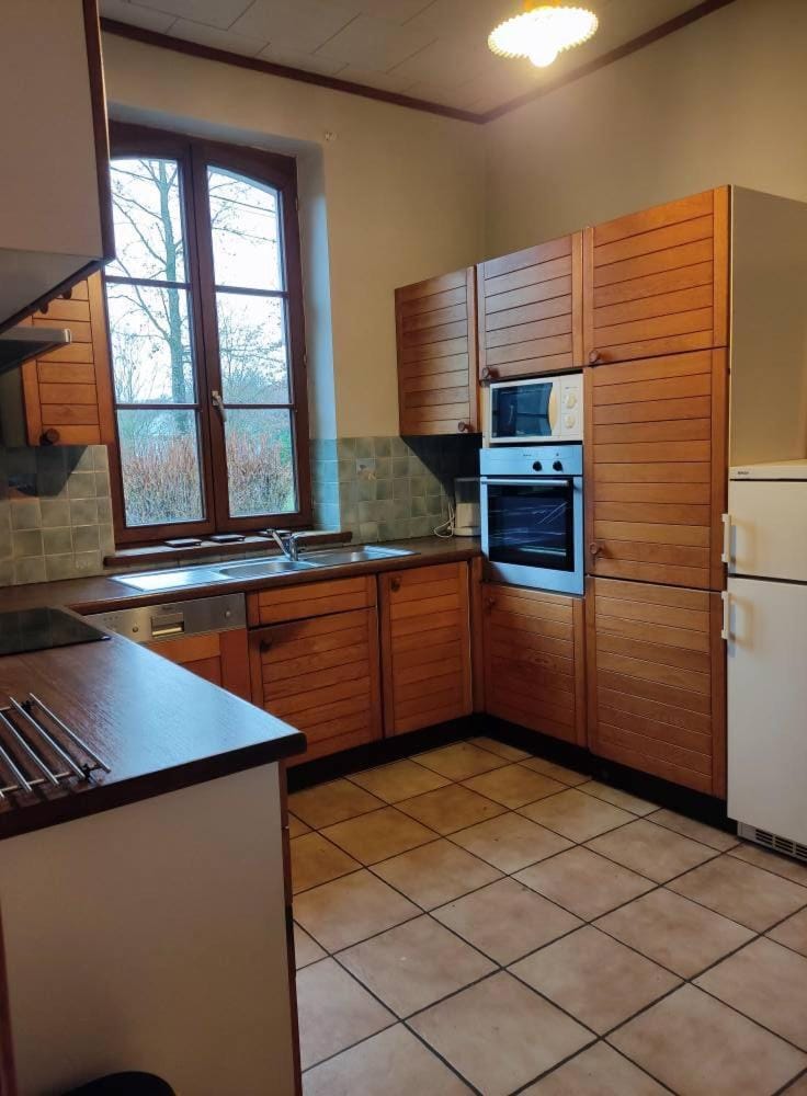 Kitchen or kitchenette, dishwasher, oven, stove