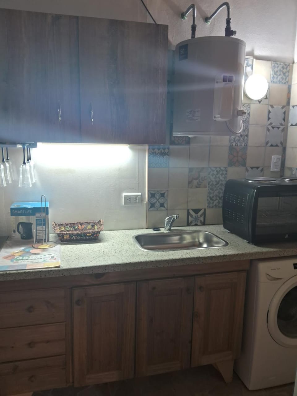 Kitchen or kitchenette, oven, washing machine, dryer