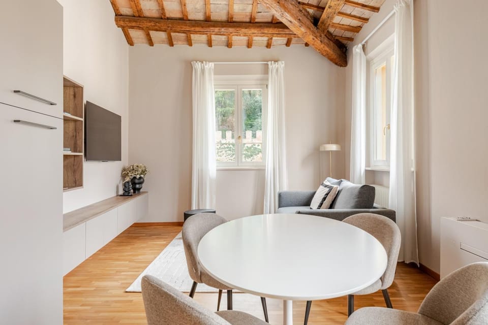 Property building, TV and multimedia, View (from property/room), Living room, Seating area, City view, City view, Garden view, Garden view