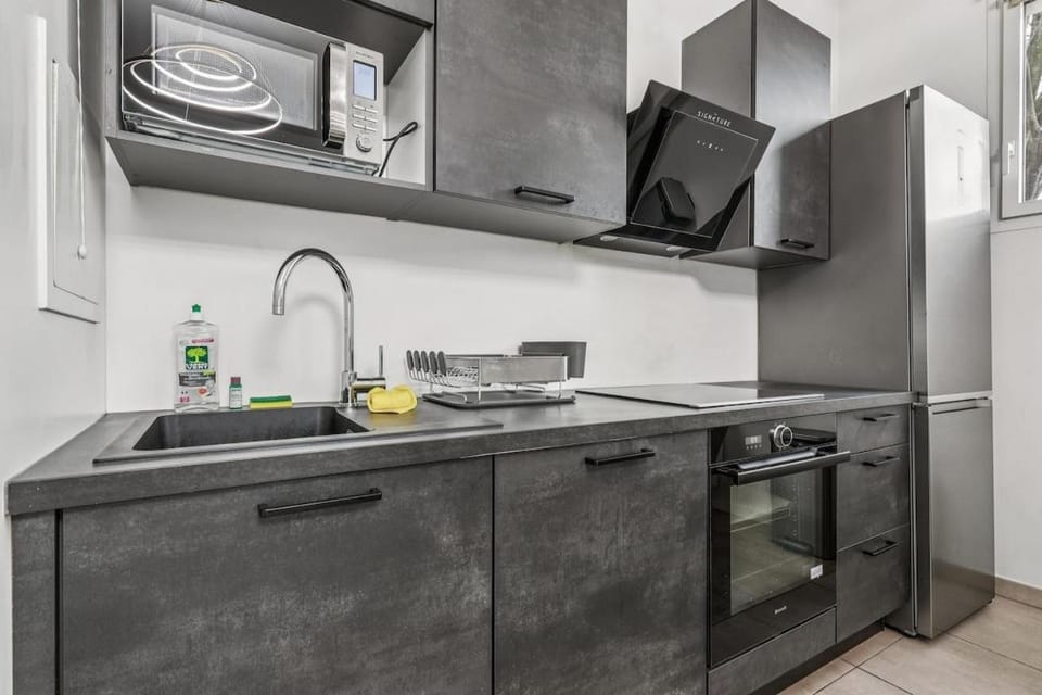 Kitchen or kitchenette, dishwasher, oven, stove
