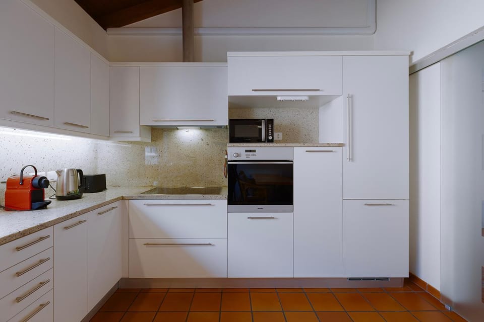 Kitchen or kitchenette, dishwasher, oven, stove, air conditioner
