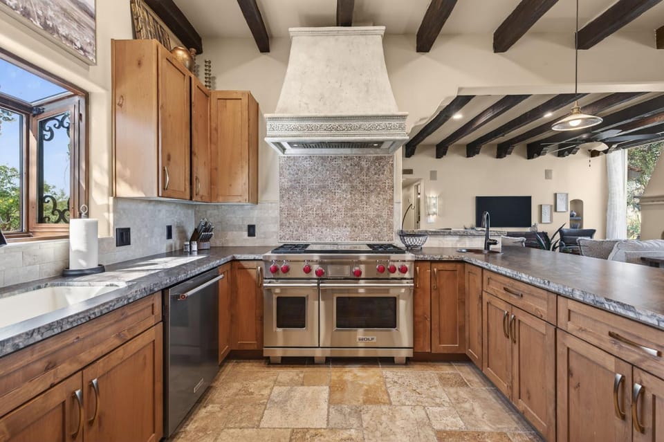 Kitchen or kitchenette, dishwasher, oven, stove