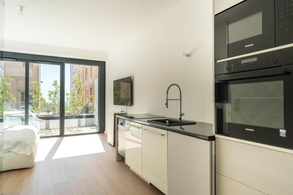 Kitchen or kitchenette, microwave, oven, stove