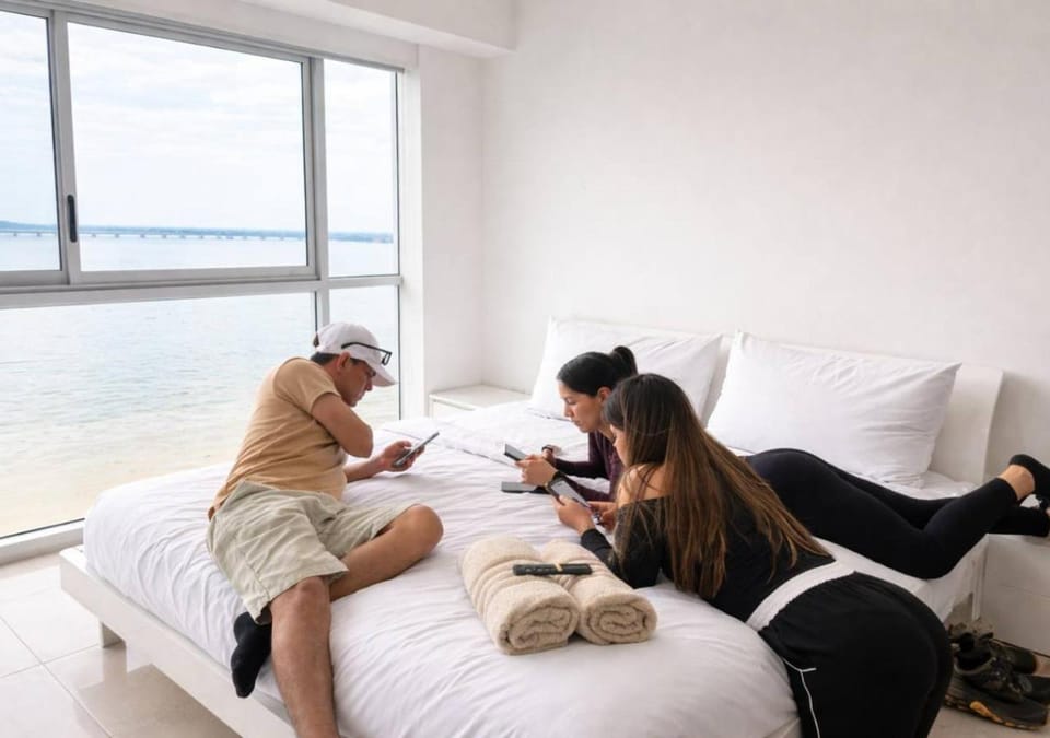 Bed, People, Bird's eye view, Living room, Photo of the whole room, Seating area, Bedroom, Guests, River view, group of guests, towels, air conditioner