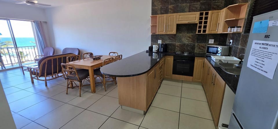 Seating area, stove, toaster, kitchen