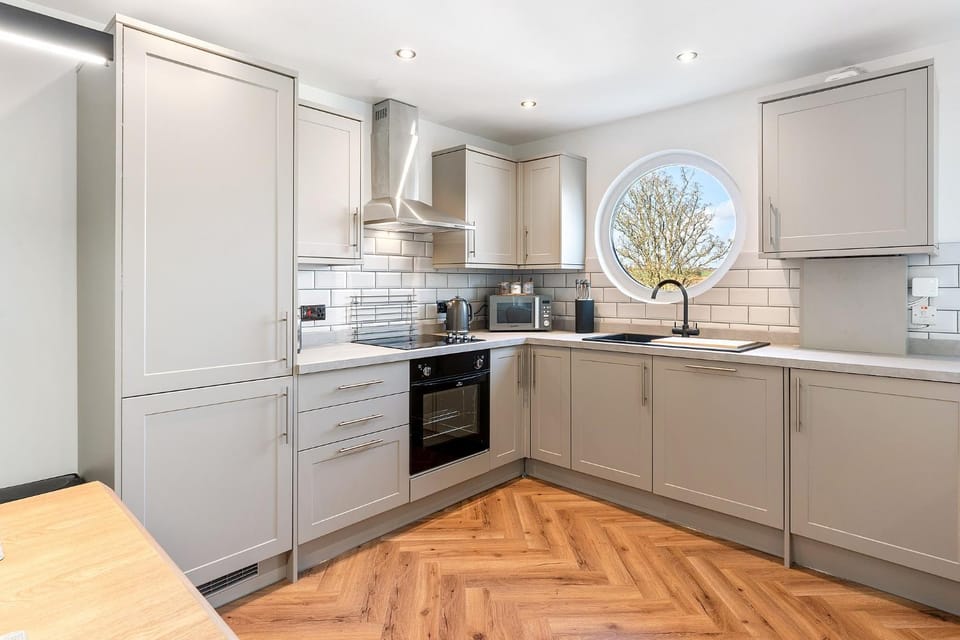 Kitchen or kitchenette, dishwasher, oven, stove, toaster