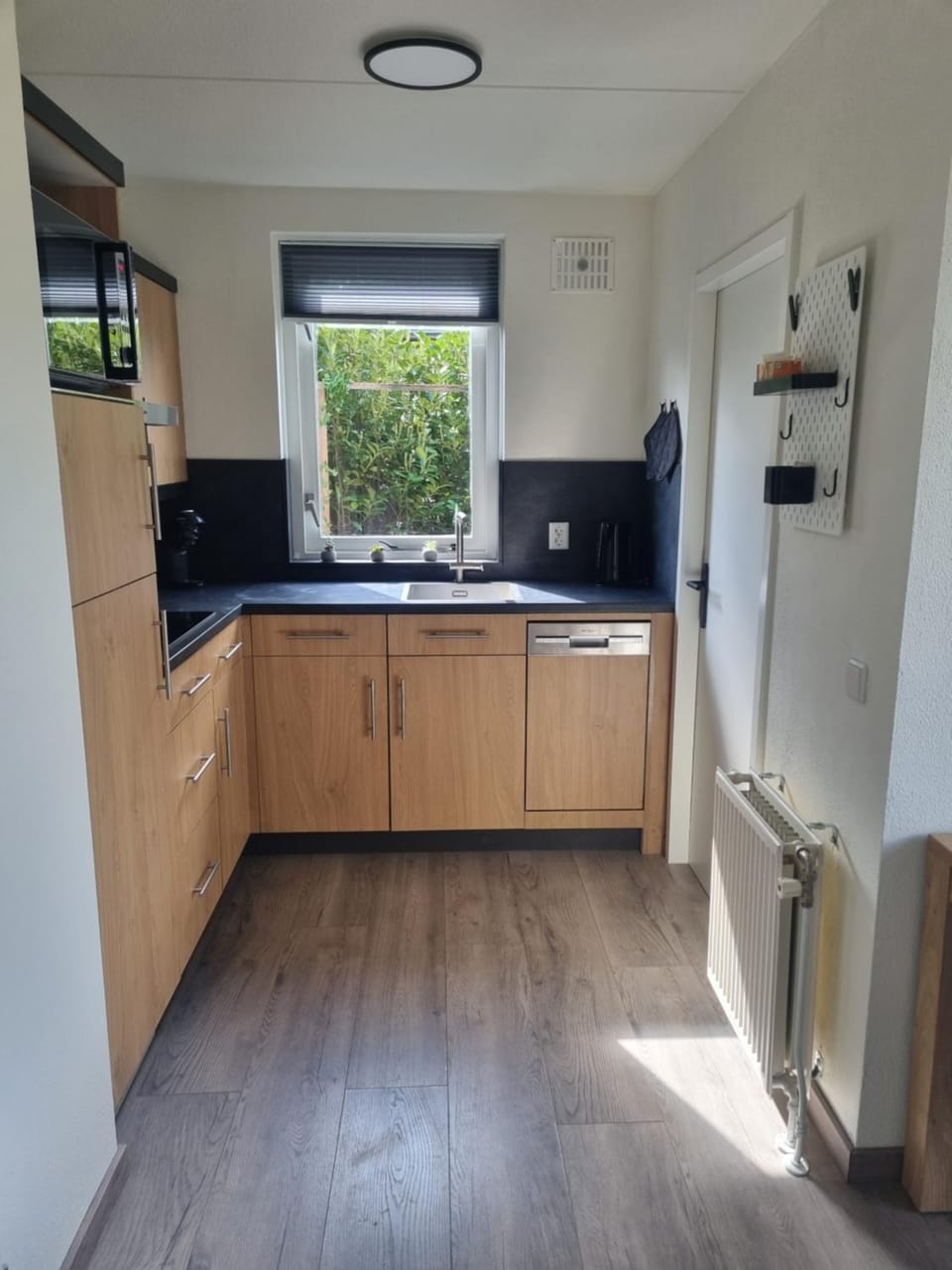 Kitchen or kitchenette, dishwasher, oven, stove