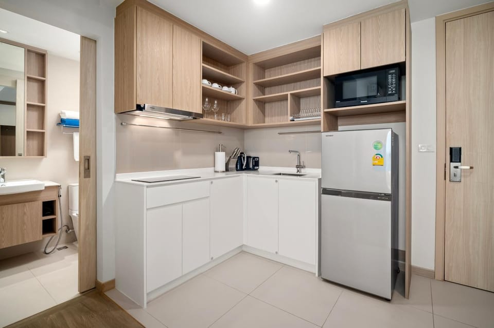 Kitchen or kitchenette, microwave, stove, toaster