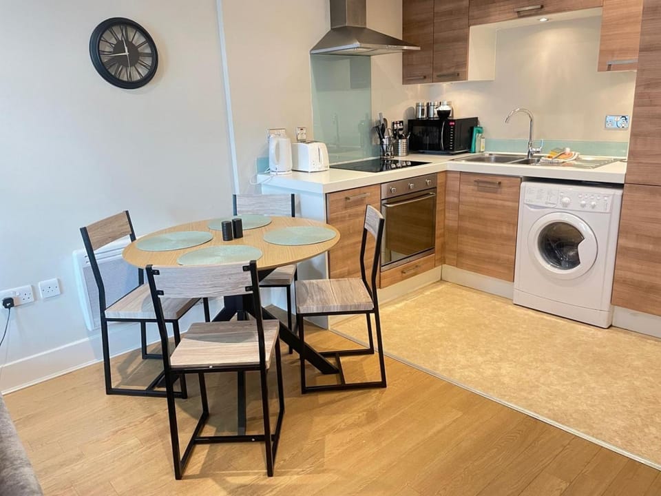Kitchen or kitchenette, Living room, Seating area, Dining area, oven, stove, toaster, washing machine