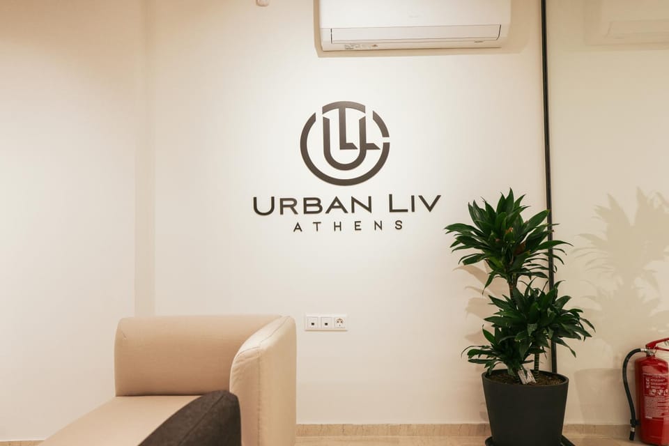 Property logo or sign, Seating area, Logo/Certificate/Sign, Text overlay, air conditioner