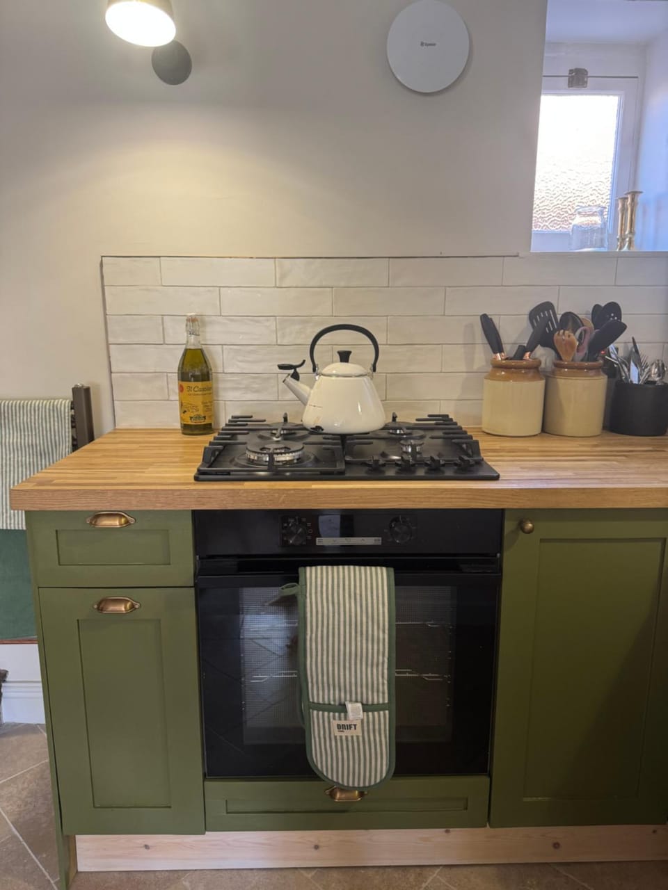 Kitchen or kitchenette, storage, stove