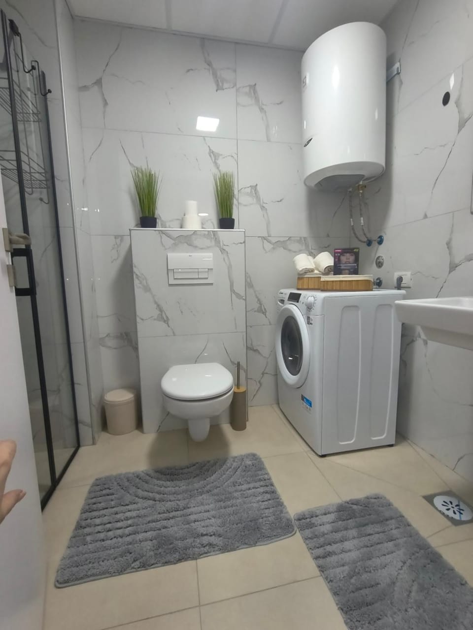 Toilet, Bathroom, hair dryier, towels, washing machine, dryer