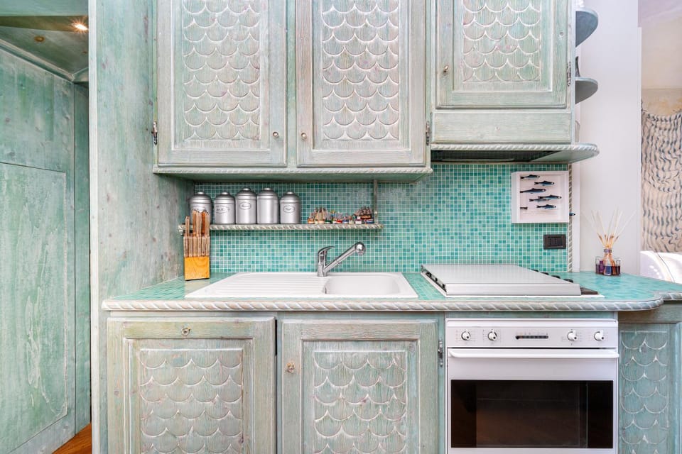 Kitchen or kitchenette, dishwasher, oven, stove