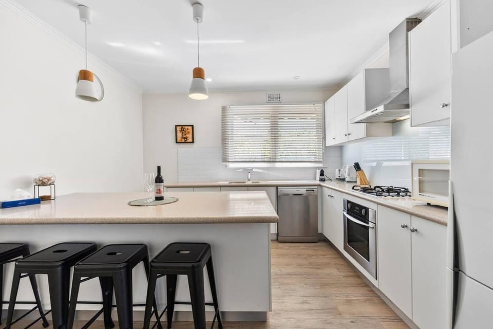 Kitchen or kitchenette, dishwasher, oven, stove