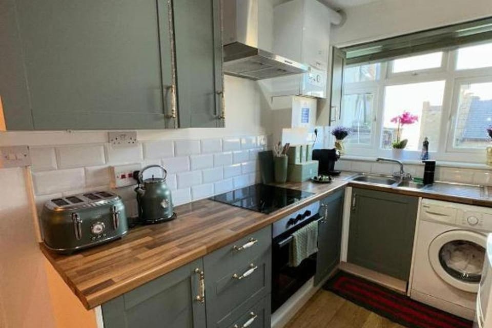 Kitchen or kitchenette, oven, stove, toaster, washing machine