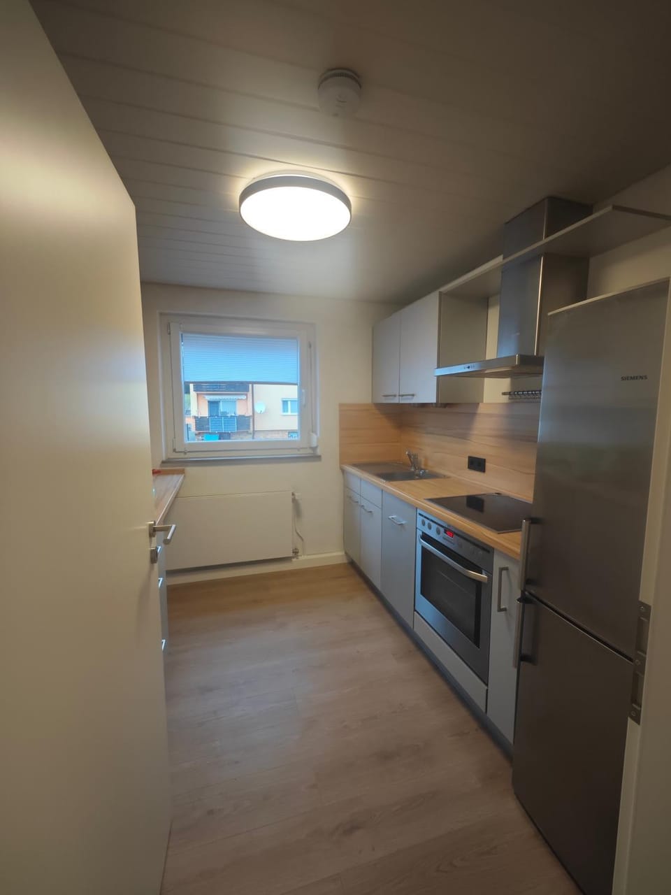 Kitchen or kitchenette, dishwasher, oven, stove