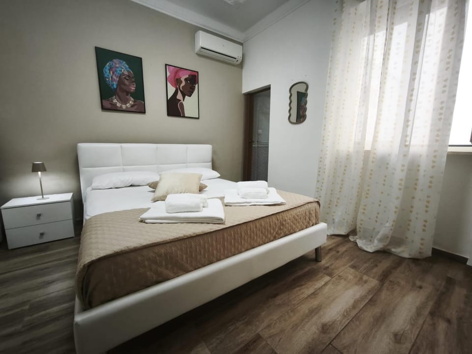 Photo of the whole room, Bedroom, towels, air conditioner