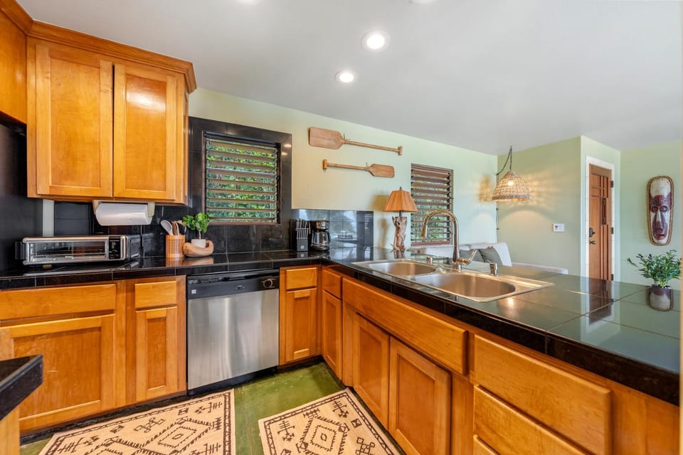 Kitchen or kitchenette, dishwasher, furniture, microwave, toaster