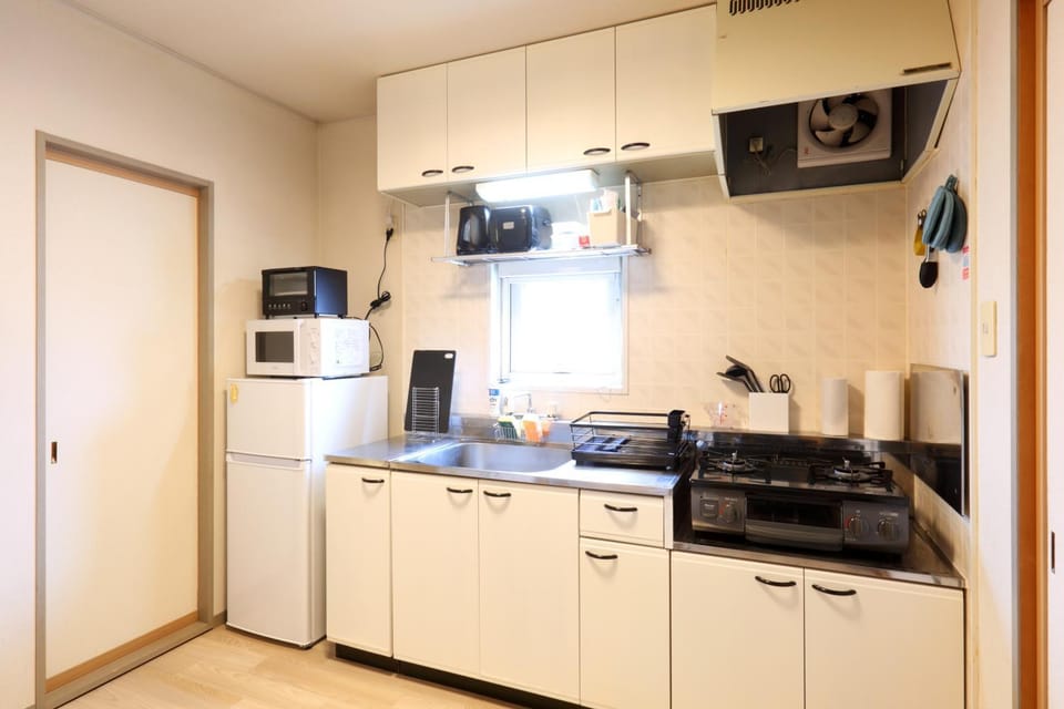 Kitchen or kitchenette, stove, toaster