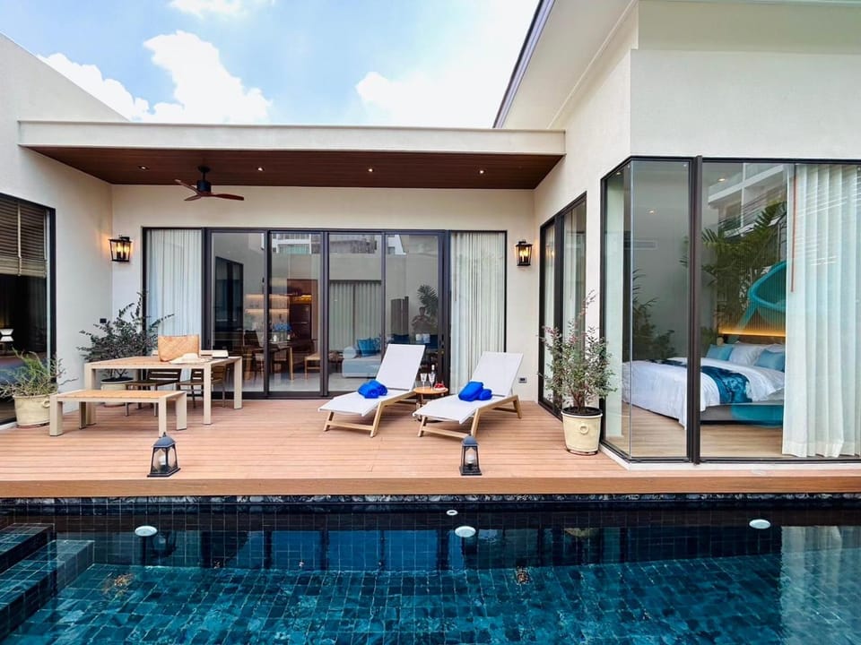 Property building, Patio, Day, Living room, Seating area, Pool view, Swimming pool, sunbed