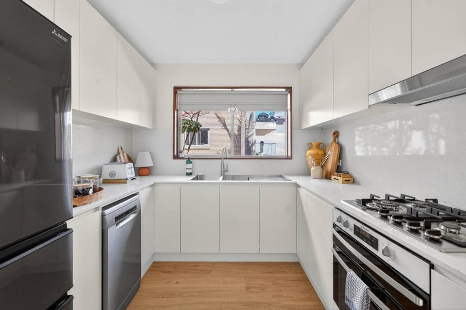 Kitchen or kitchenette, dishwasher, oven, stove