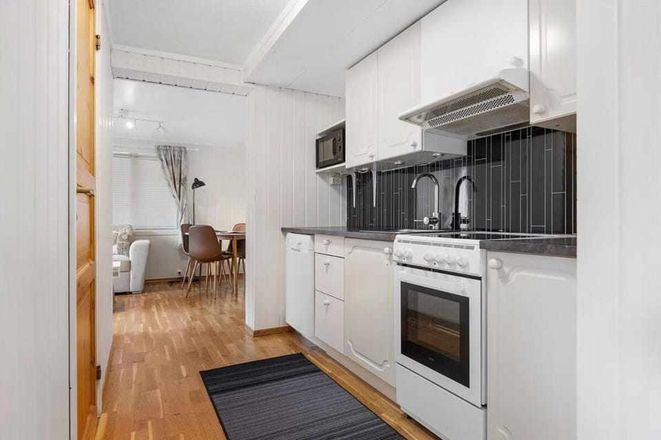 Kitchen or kitchenette, dishwasher, oven, stove