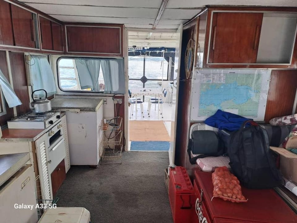 'Lekker' off grid Houseboat escape - adventure & serenity on Lake Kariba Docked boat in Zimbabwe