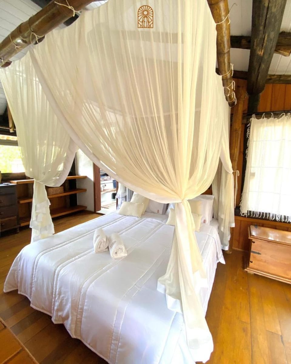 Chalé romântico no condomínio - suite com ar condicionado, churrasqueira e lagoa House in Imbituba