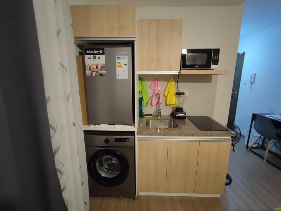 Kitchen or kitchenette, washing machine