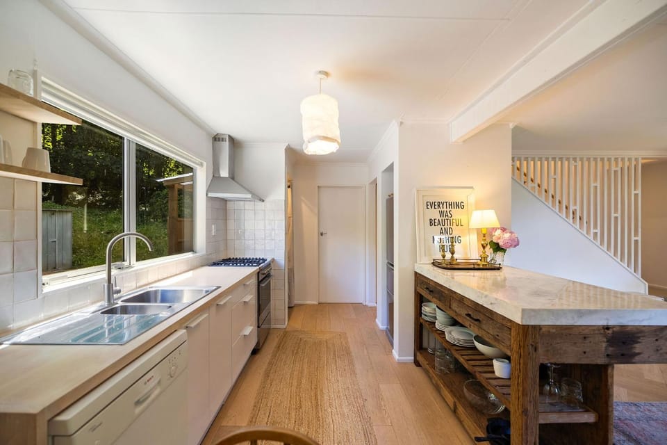 Kitchen or kitchenette, dishwasher, oven, stove