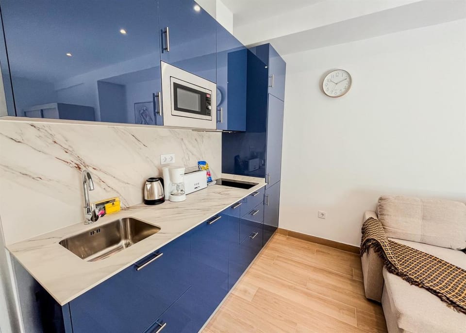 Kitchen or kitchenette, stove, toaster