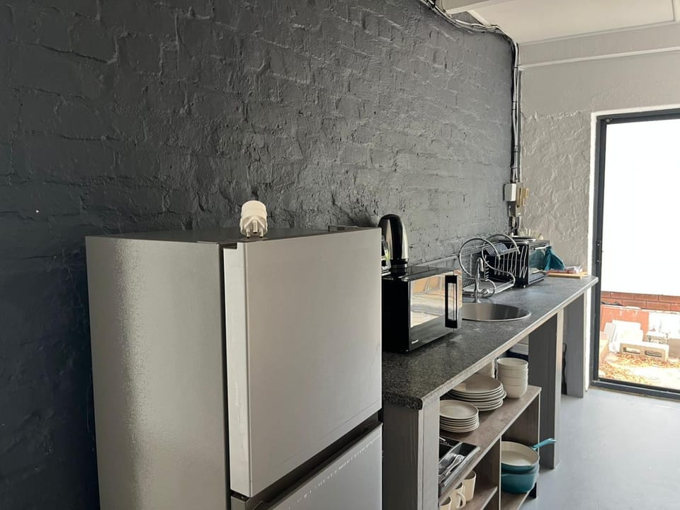 Kitchen or kitchenette, microwave, oven, toaster