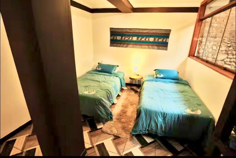 Master Suite w Private Bath in Brand New Pisac Guesthouse & CoLiving Space Vacation rental in Pisac