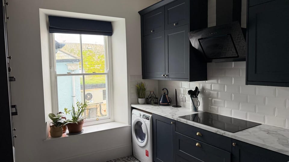 Kitchen or kitchenette, dishwasher, oven, stove, washing machine, dryer