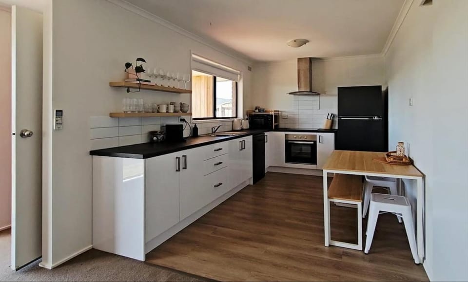 Kitchen or kitchenette, dishwasher, oven, stove, toaster