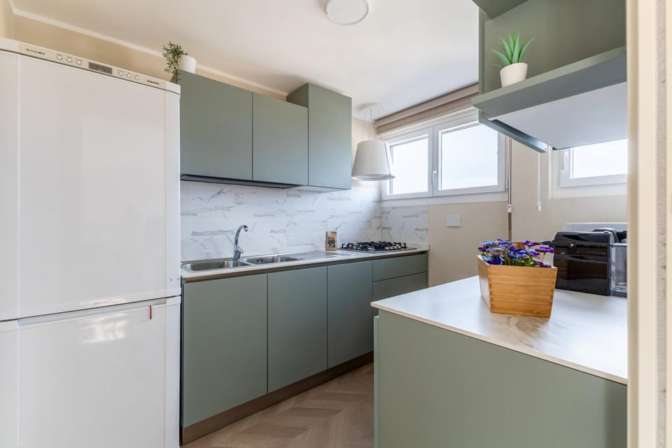 Kitchen or kitchenette, dishwasher, oven, stove