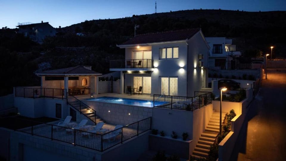 Property building, Patio, Night, Natural landscape, View (from property/room), Balcony/Terrace, Mountain view, Pool view, Swimming pool, sunbed