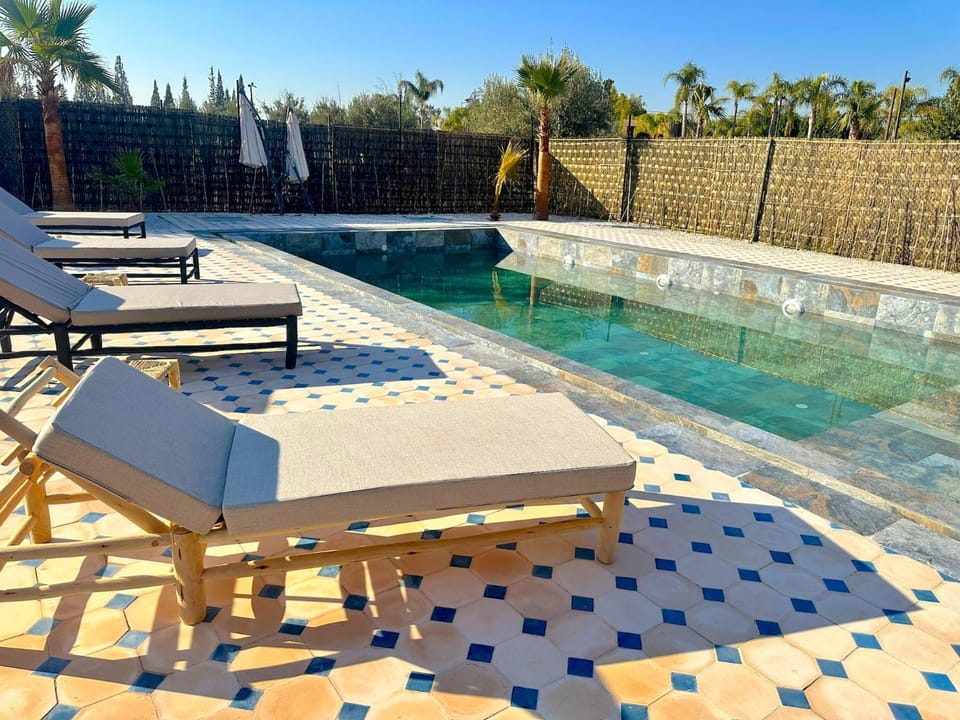 Patio, Day, Natural landscape, Pool view, Swimming pool, sunbed