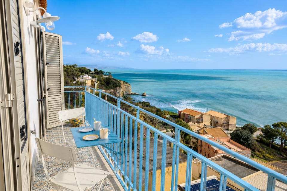 Property building, Patio, Nearby landmark, Day, Natural landscape, View (from property/room), Balcony/Terrace, Beach, Sea view